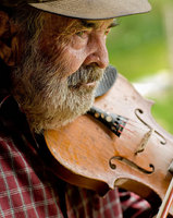 portrait of Cast King who grew up on Sand Mountain where he formed his first band
around the age of 15, which played for local audiences. He performed in
a succession of bands after that, playing bluegrass and country music
throughout the region. I guess I rode a million miles under a bass
fiddle, he recalled. As the founder and leader of Cast King and the
Country Drifters, he recorded a number of sides for Sun Records in the
early 1950s. An accomplished guitarist and fiddler, he has also written
more than 500 songs