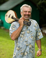 portrait of Dennis George, from Fyffe. He is a native of Sand Mountain, is a talented musician who
plays mandolin, guitar, fiddle and dobro. George is an original
member of the Melody Men, a southern gospel group that was once
featured on A Prairie Home Companion. In addition to old-time string
music, George is also a singer of both Sacred Harp and seven-shape
note gospel convention music and is a published songwriter of the latter
genre. He was one of the Sacred Harp singers featured on the
soundtrack of the film Cold Mountain.